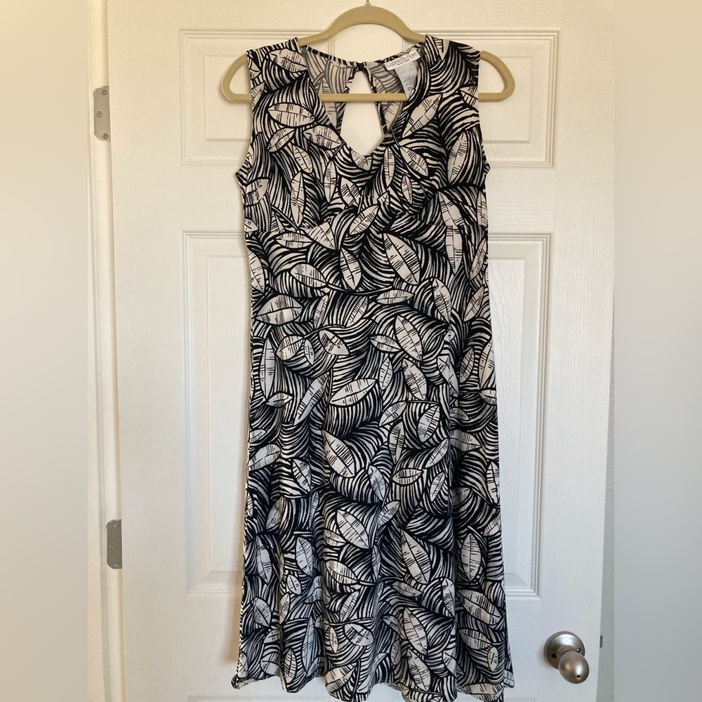 Black and off white empire waist, sleeveless midi length knit dress